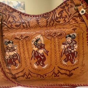 Artisan Leather Shoulder Bag with Intricate Design that’s carved by artesian